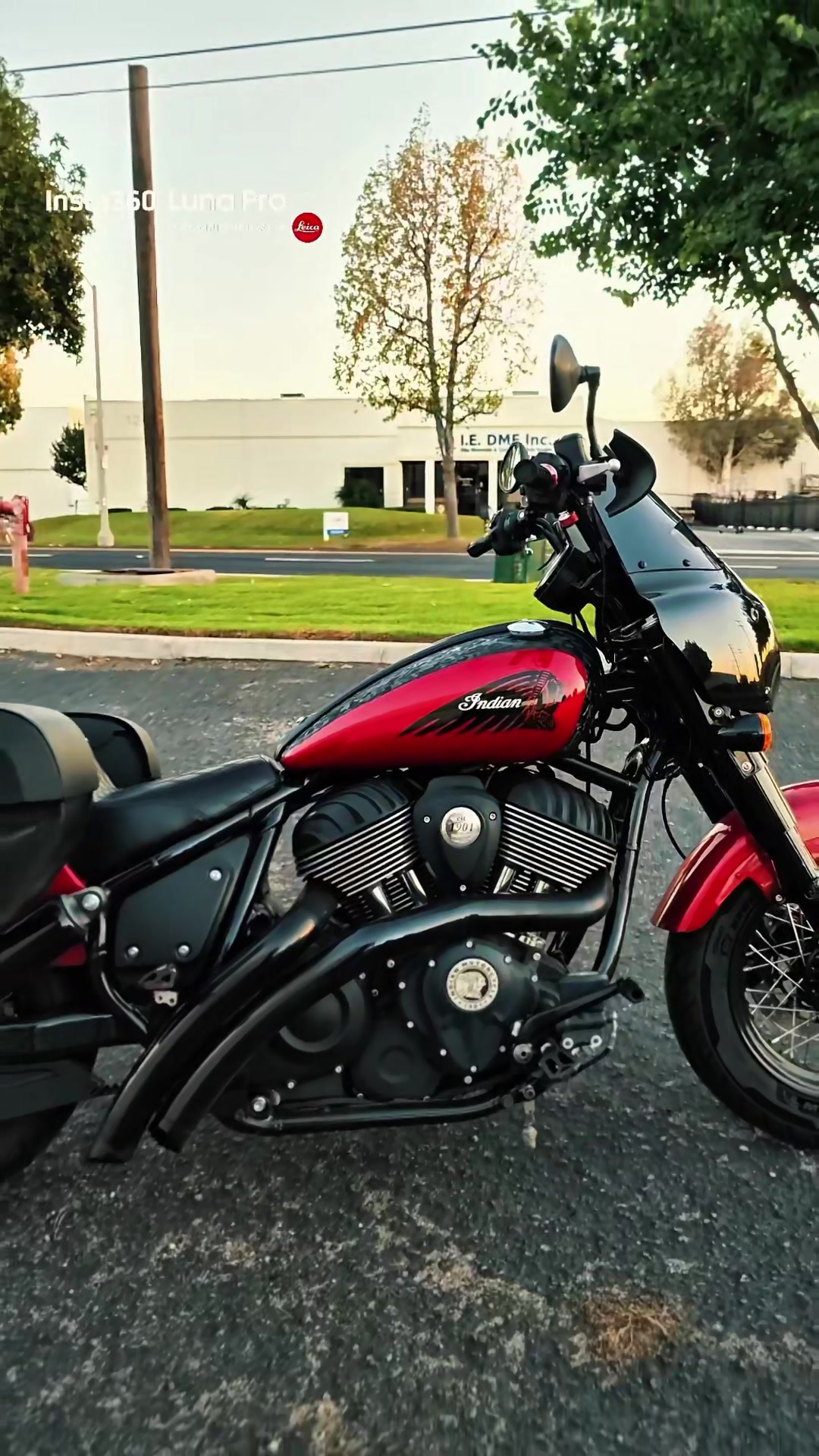 Red Indian motorcycle parked in profile at golden hour